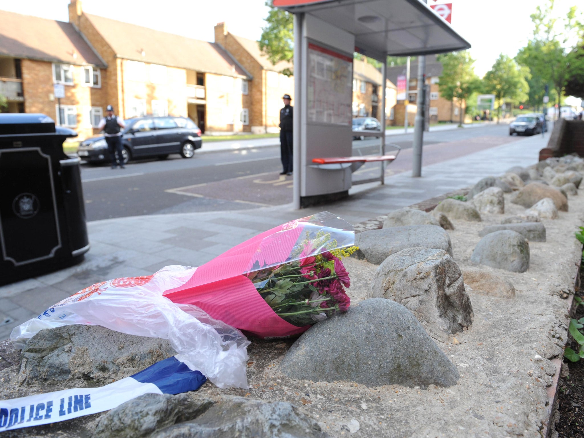 A floral tribute close to the scene where a man was murdered in John Wilson Street, Woolwich