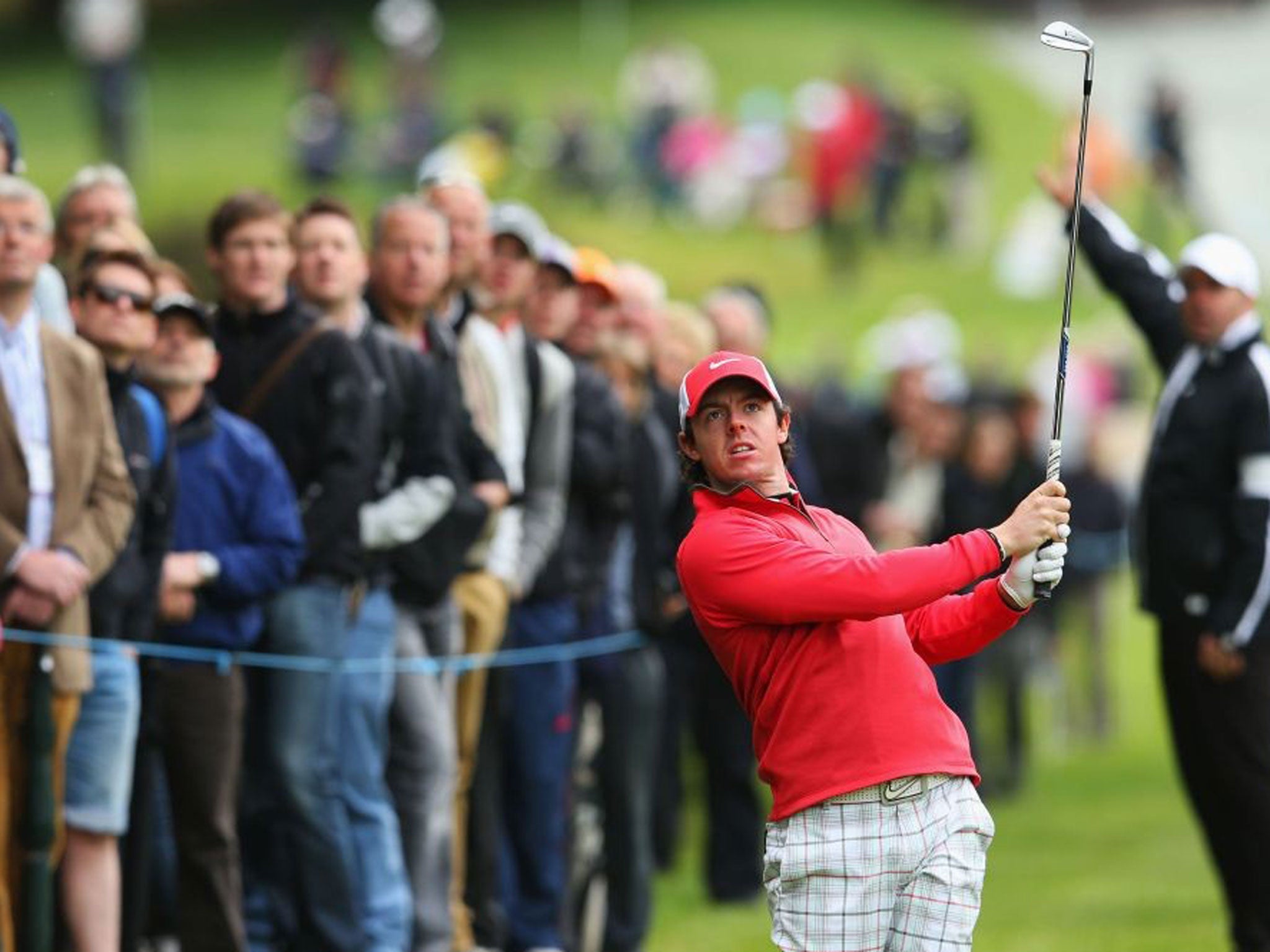 Rory McIlroy of Northern Ireland hits an approach during the first round of the BMW PGA Championship