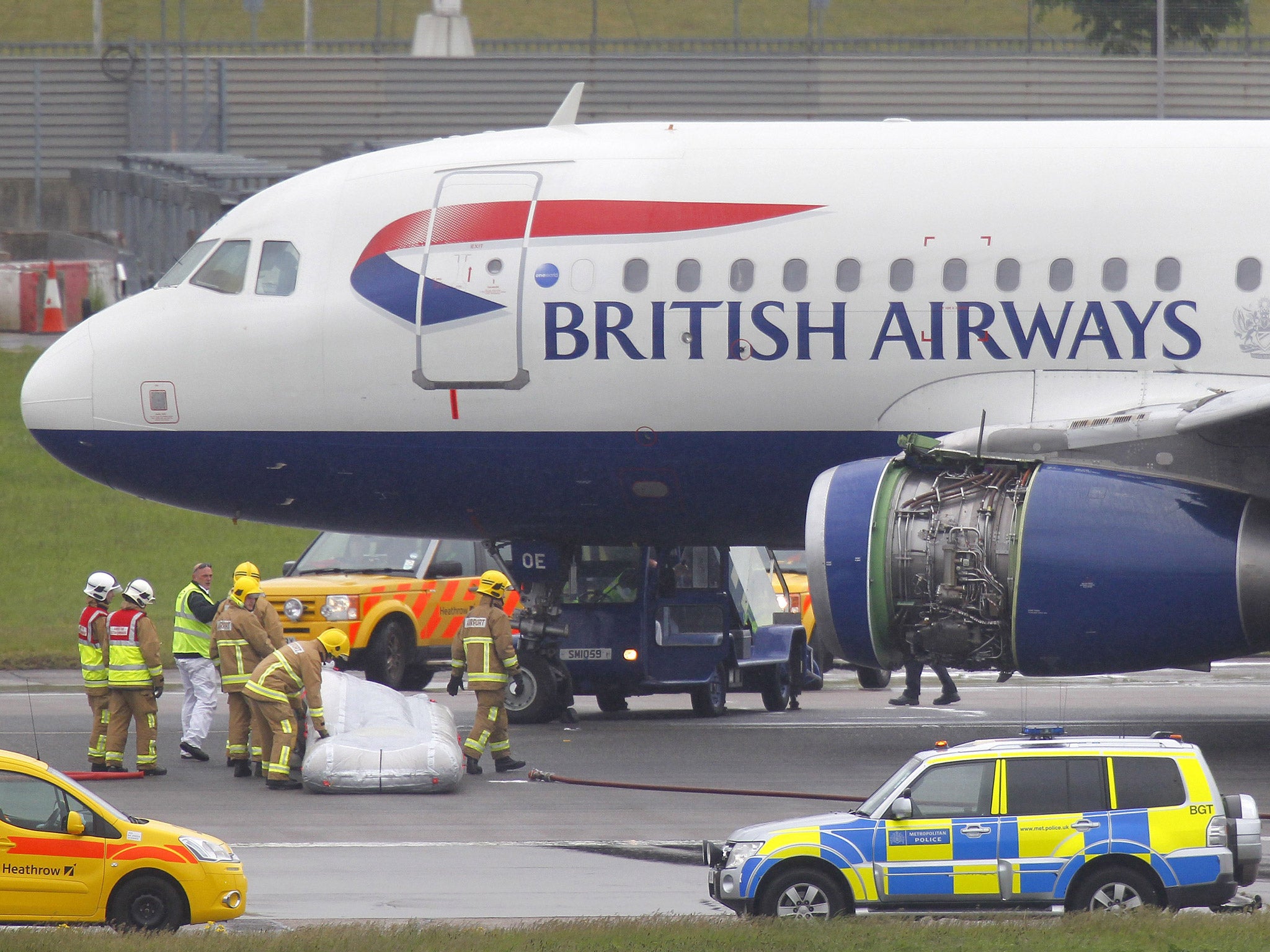 24 May 2013: Emergency services attend a British Airways passenger plane after it had to make an emergency landing at Heathrow airport