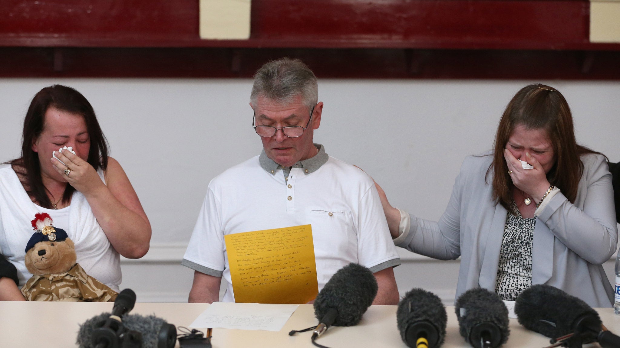 The mother and stepfather of murdered soldier Lee Rigby, Lyn and Ian Rigby and his wife Rebecca Rigby, grieve as his stepfather reads a family statement