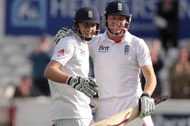 Pair of aces: Joe Root (left) is congratulated by Jonny Bairstow after hitting a four to bring up his maiden Test century against New Zealand yesterday 