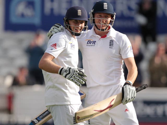 Pair of aces: Joe Root (left) is congratulated by Jonny Bairstow after hitting a four to bring up his maiden Test century against New Zealand yesterday 