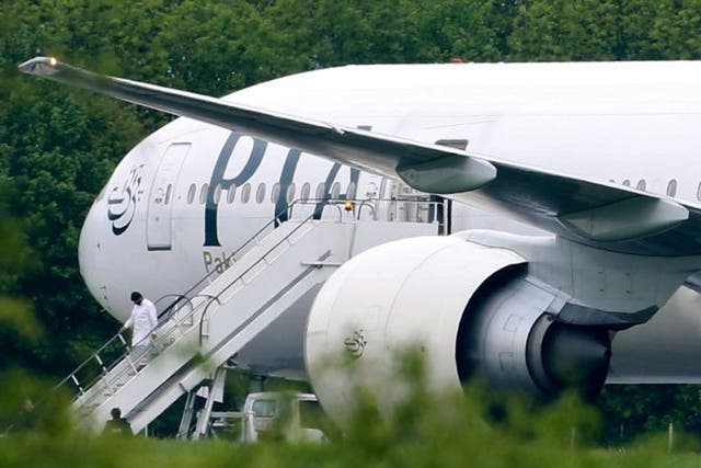 Passengers disembarking Pakistan International Airlines flight PK709 bound for Manchester from Lahore, at Stansted Airport, Essex