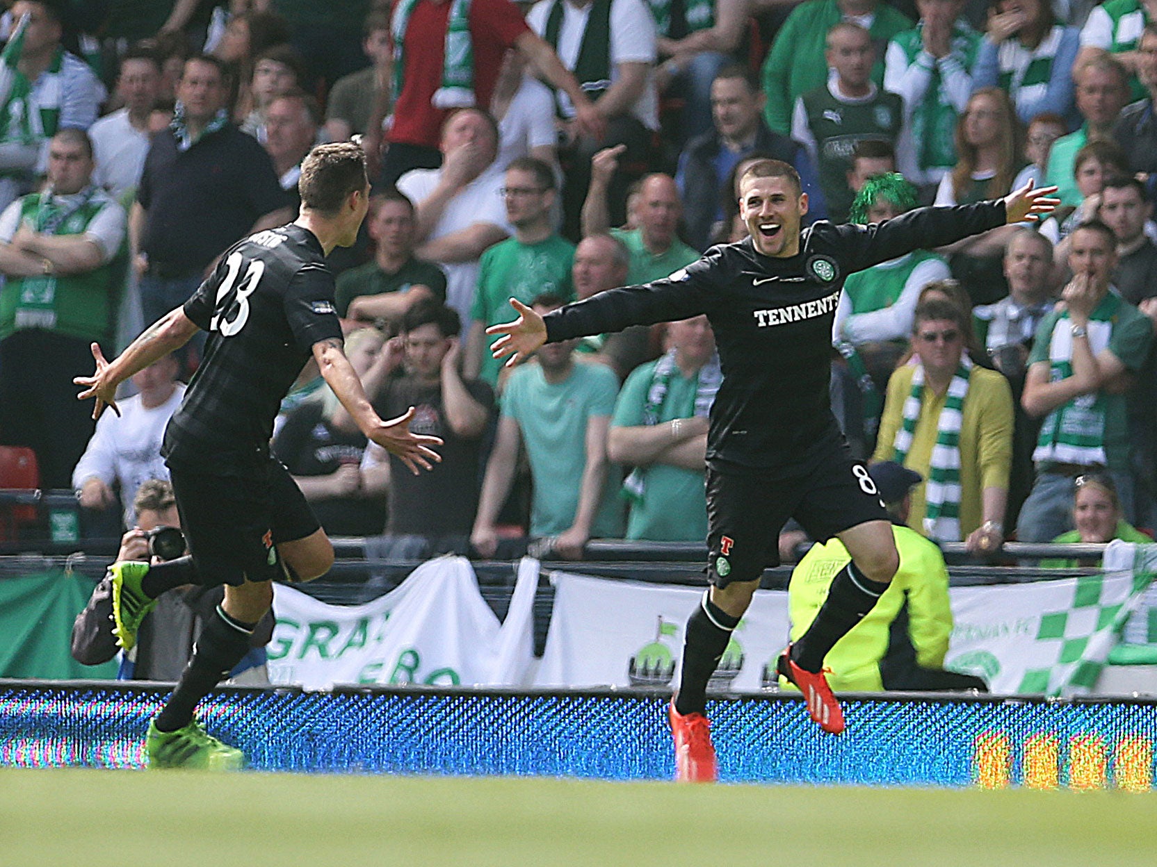 Gary Hooper (R) of Celtic celebrates after scoring the opening goal of the William Hill Scottish Cup Final