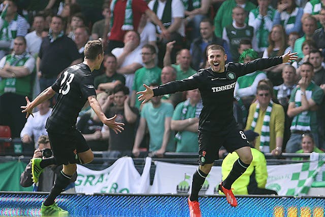 Gary Hooper (R) of Celtic celebrates after scoring the opening goal of the William Hill Scottish Cup Final