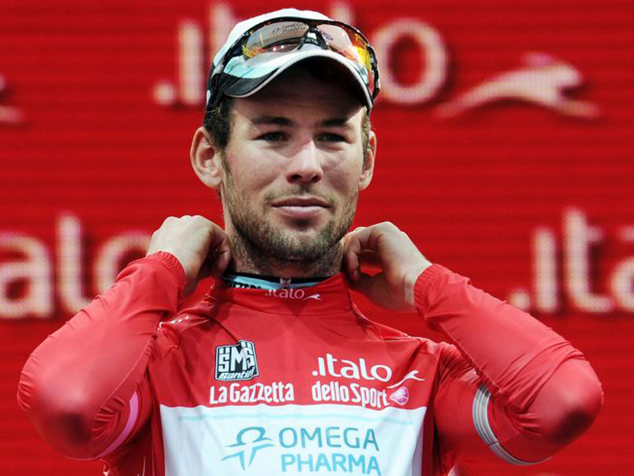 Mark Cavendish wears the red jersey as winner of the points classification (Gian Mattia D'Alberto/AP)