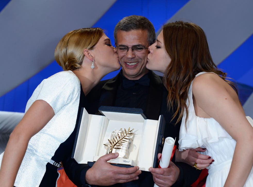 Actress Lea Seydoux, director Abdellatif Kechiche and actress Adele Exarchopoulos receive the Palme d'Or on stage at Cannes 2013