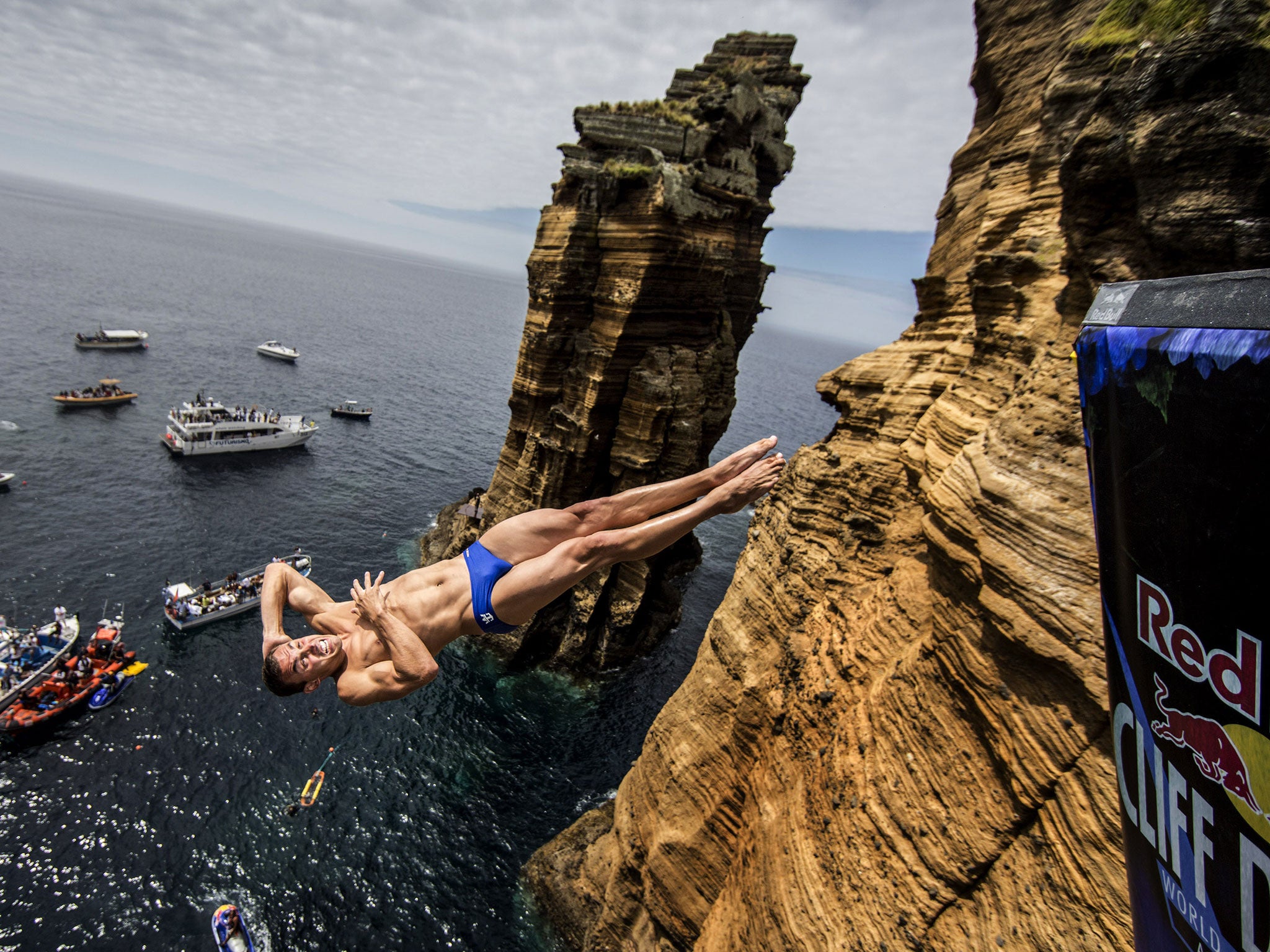 Michal Navratil of the Czech Republic dives from the 27.5 metre rock during the third stop of the Red Bull Cliff Diving World Series at Islet Vila Franca do Campo, Azores, Portugal