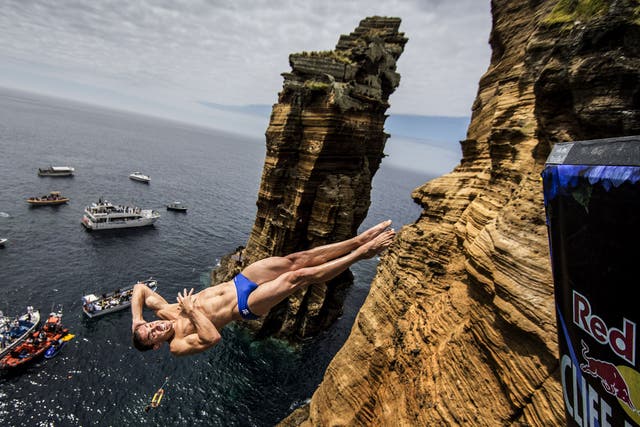 Michal Navratil of the Czech Republic dives from the 27.5 metre rock during the third stop of the Red Bull Cliff Diving World Series at Islet Vila Franca do Campo, Azores, Portugal