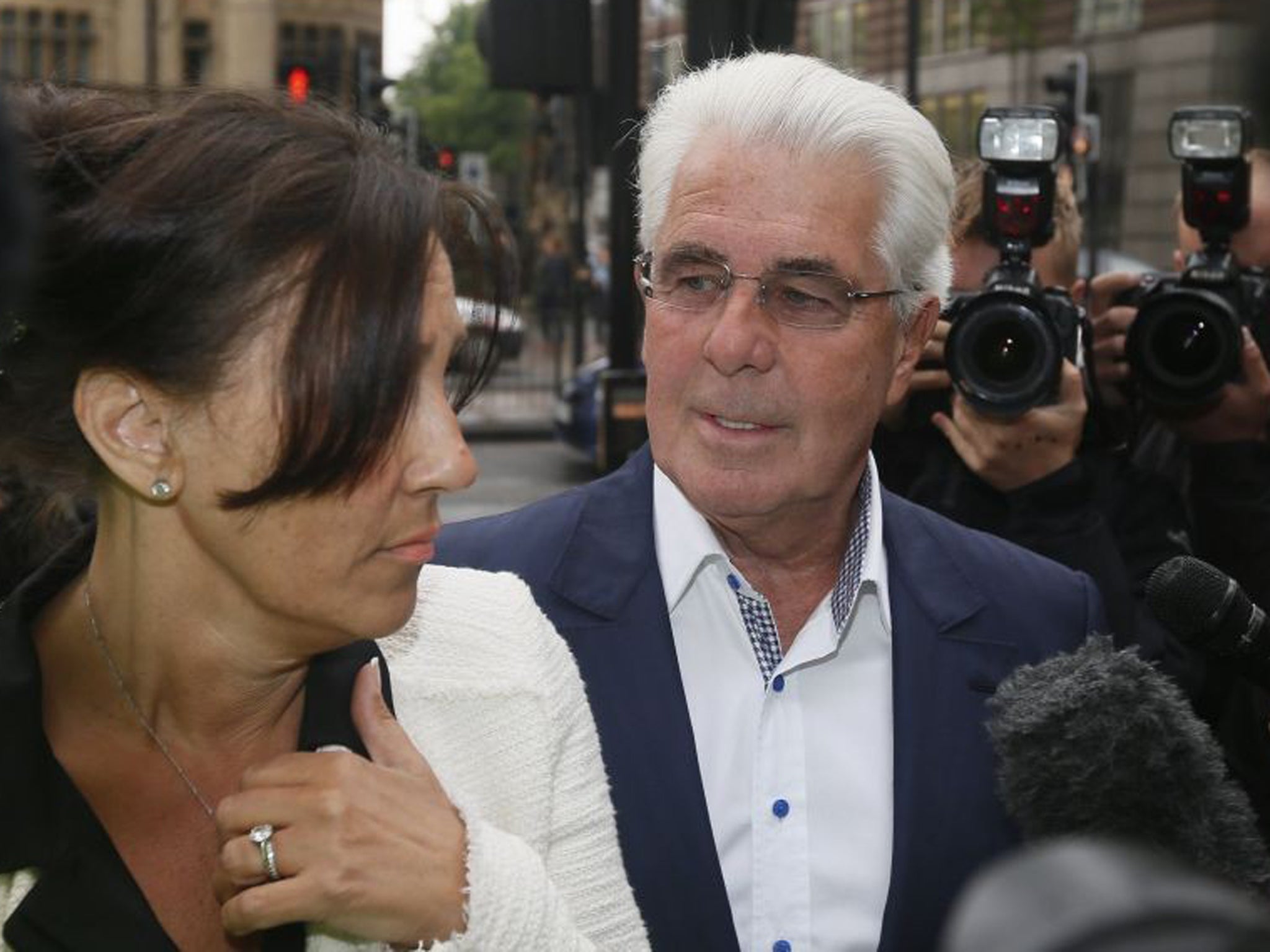 Max Clifford arrives at Westminster Magistrates Court with his wife Jo