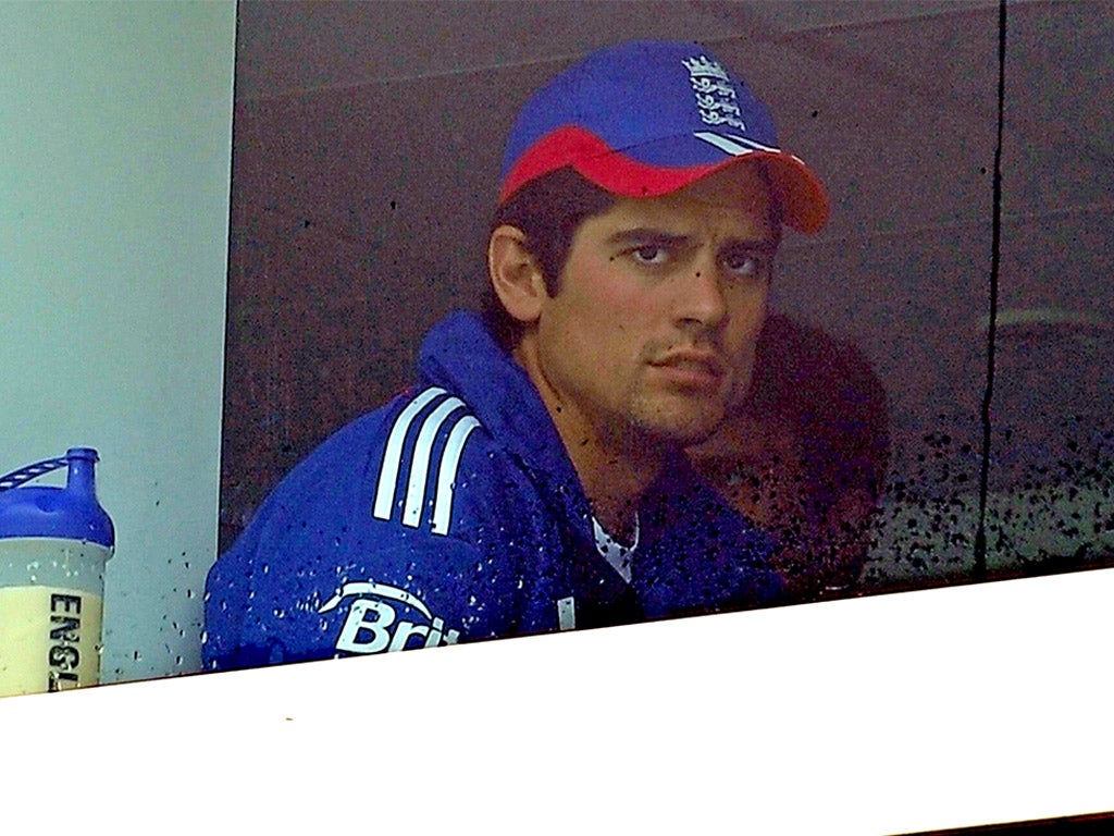 Alastair Cook looks on nervously during a rain break yesterday