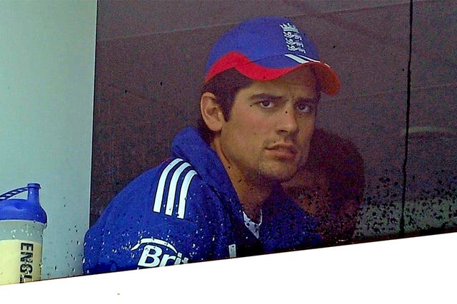 Alastair Cook looks on nervously during a rain break yesterday