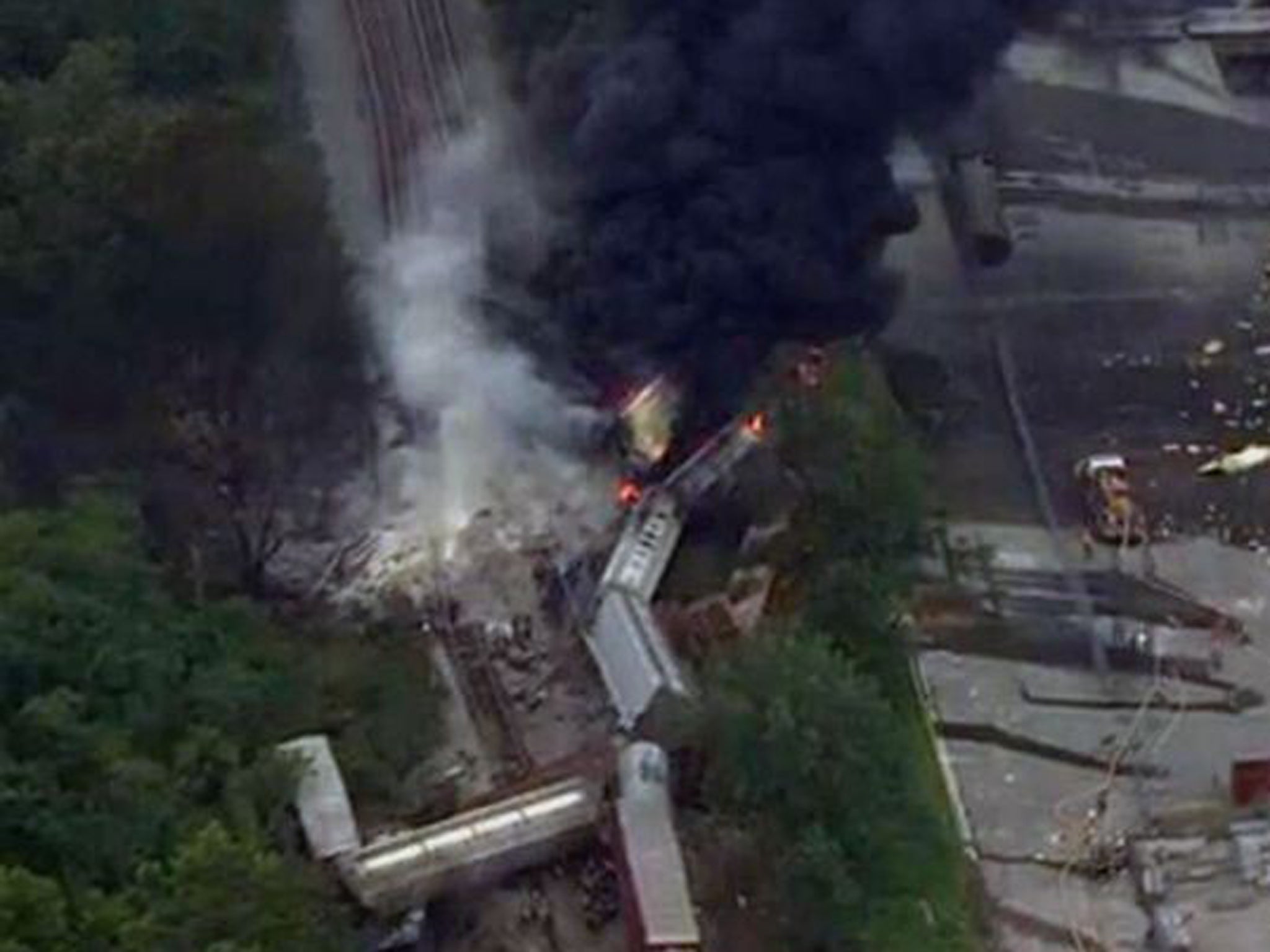Local news pictures show smoke billowing from the train wreckage