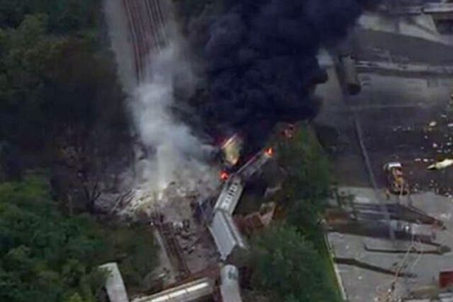 Local news pictures show smoke billowing from the train wreckage