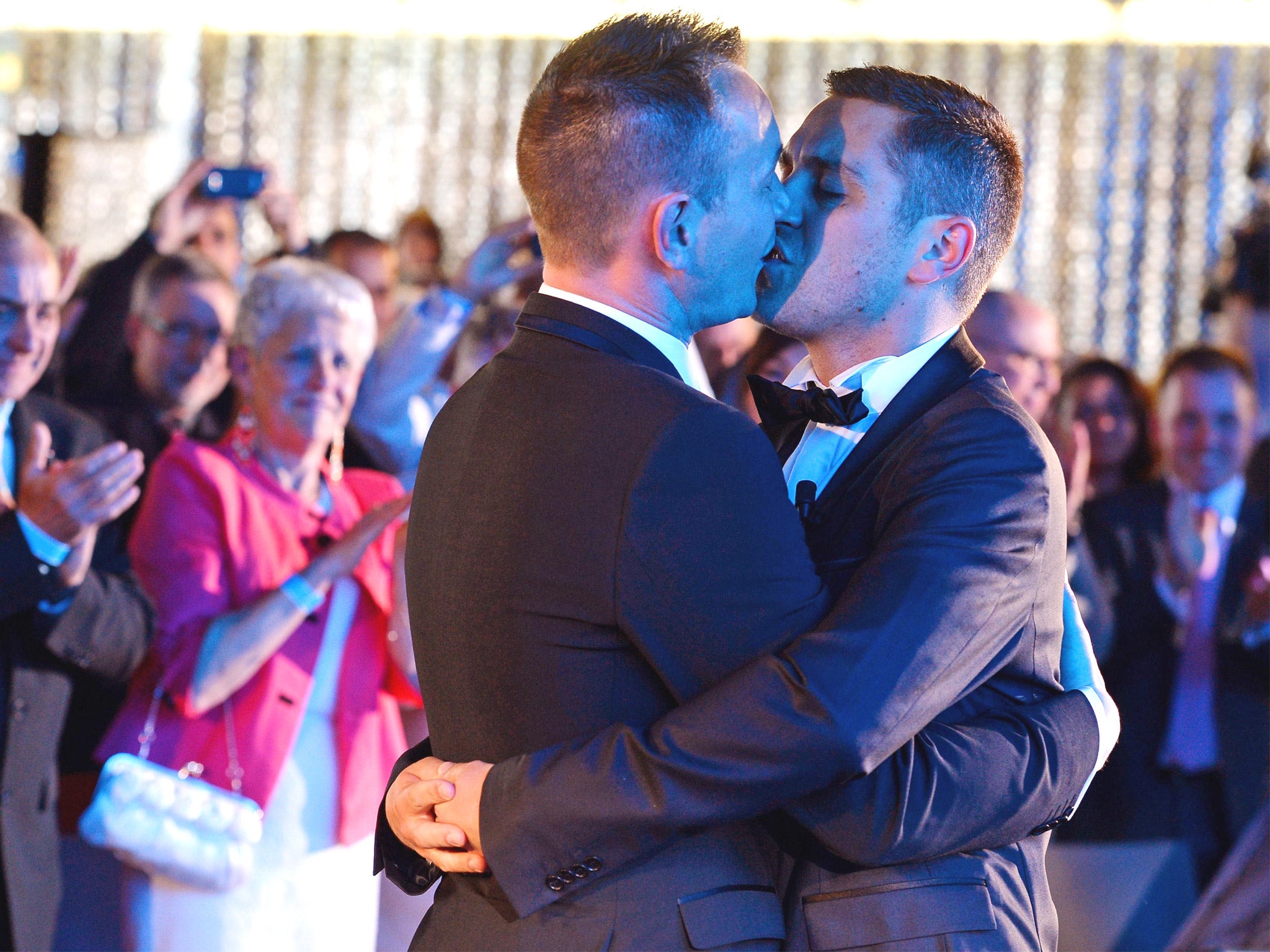 Vincent Autin, left, and Bruno Boileau kiss at France’s first official gay marriage in Montpellier