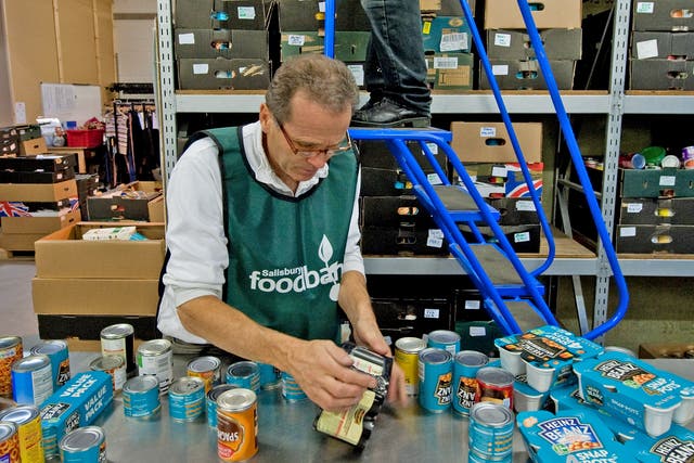 A volunteer at a Trussell Trust food bank sorts donations to the charity in Salisbury, Wiltshire
