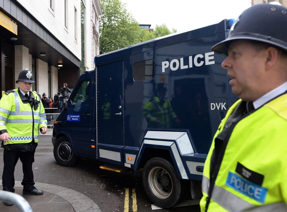 A police van carrying Michael Adebowale arrives at the Westminster Magistrates Court in London