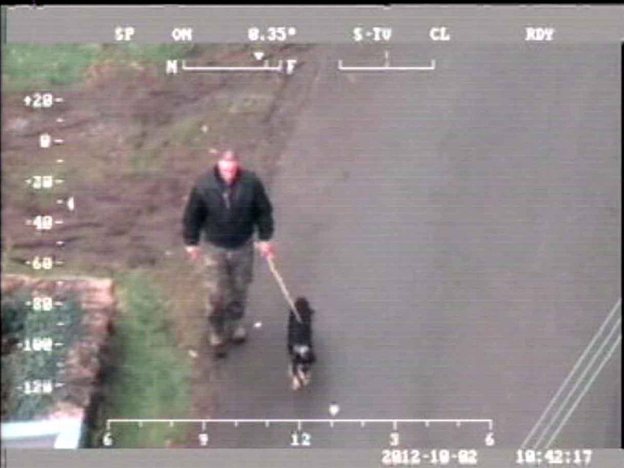 CCTV still issued by Dyfed Powys Police of Mark Bridger with his dog in Ceinws, Mid Wales during the search for April Jones.