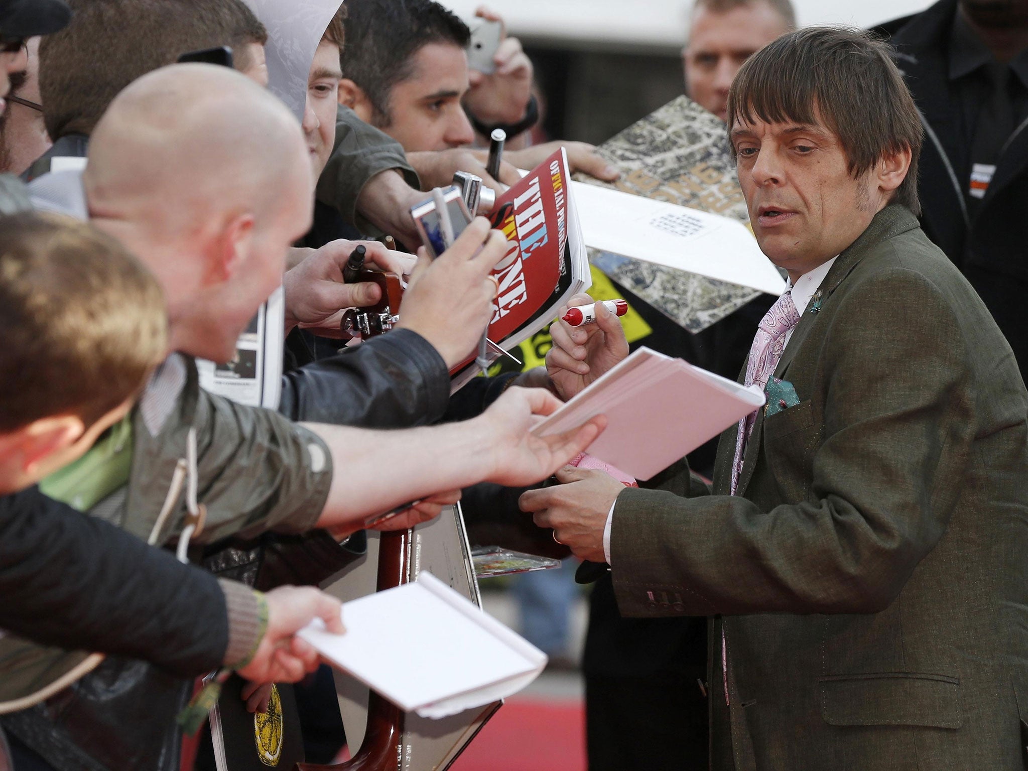 Stone Roses bass player Mani signs autographs