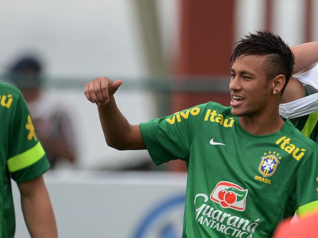 Neymar takes part in a training session with Brazil