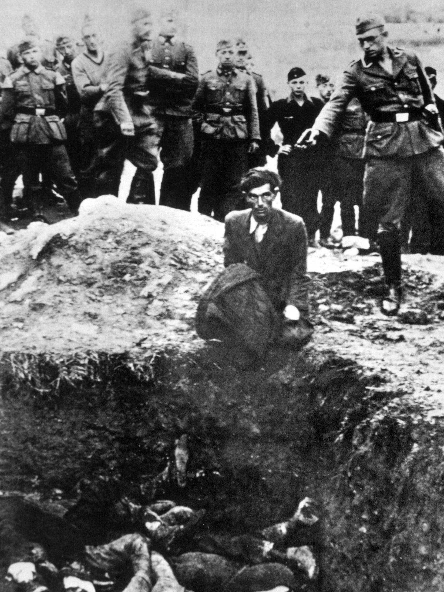 A German soldier executes Polish civilians in 1939