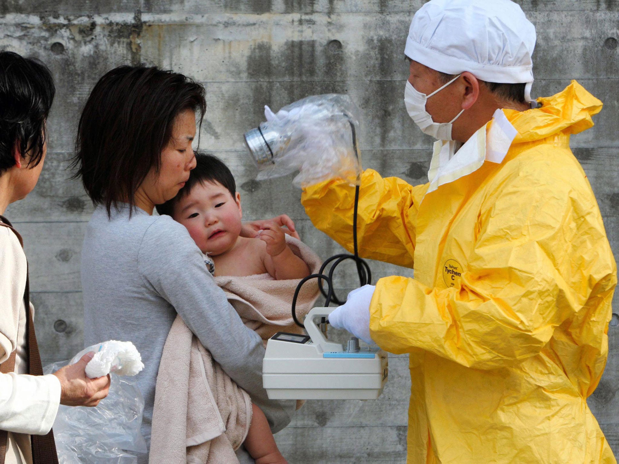 A child is tested for radiation after the accident in March 2011