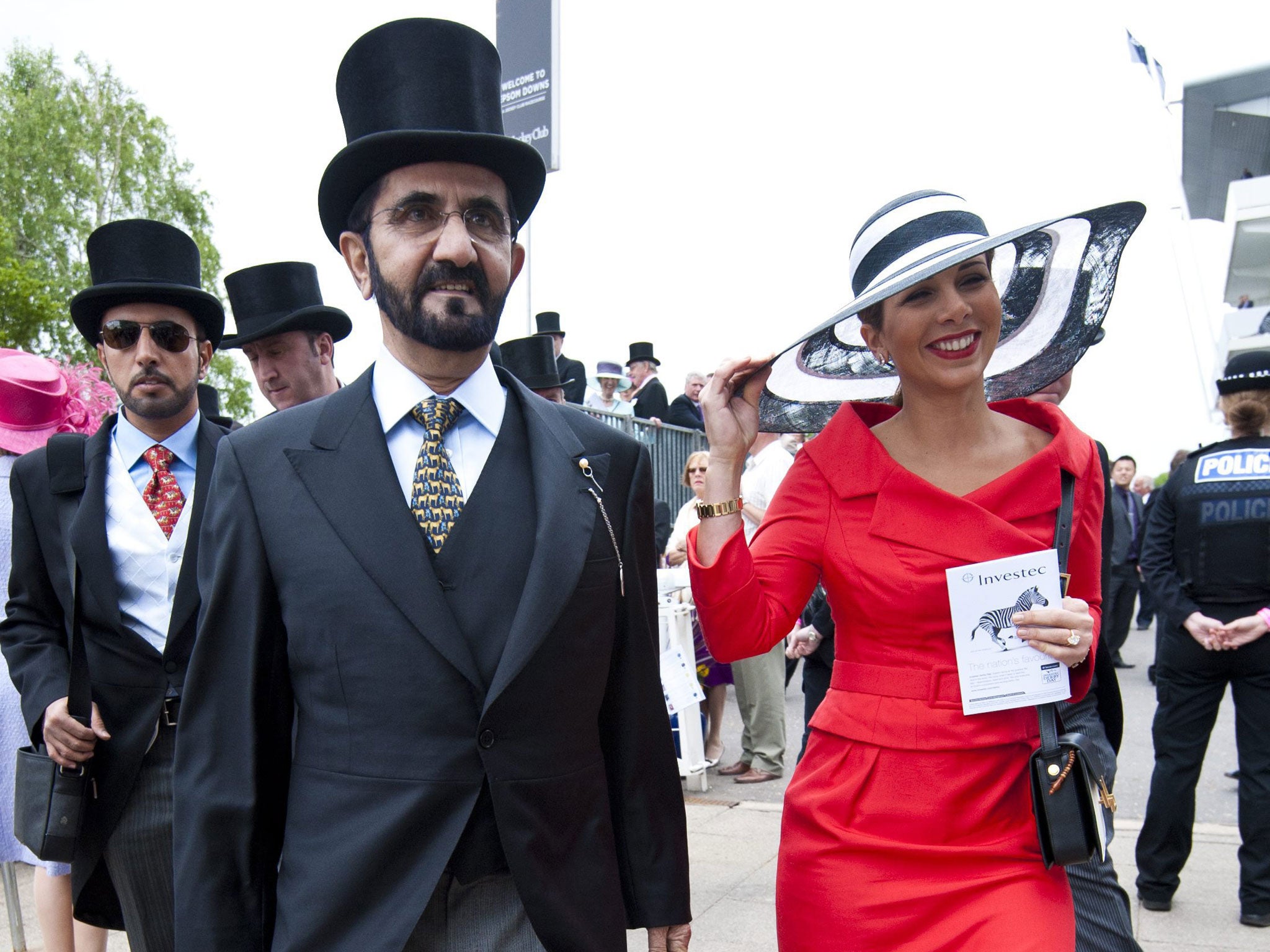 High hopes: Sheikh Mohammed arrives at Epsom with his wife, the Jordanian princess Haya, but there was no joy for Godolphin in the Derby yesterday