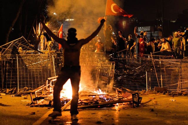 Protestors clash with riot police between Taksim and Besiktas in Istanbul, 