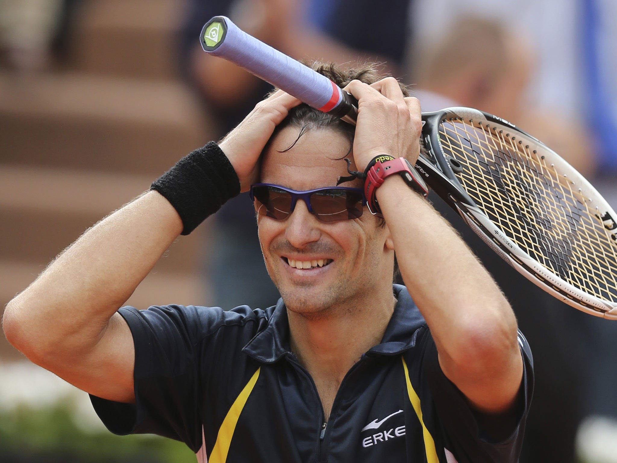 Tommy Robredo celebrates his unlikely victory