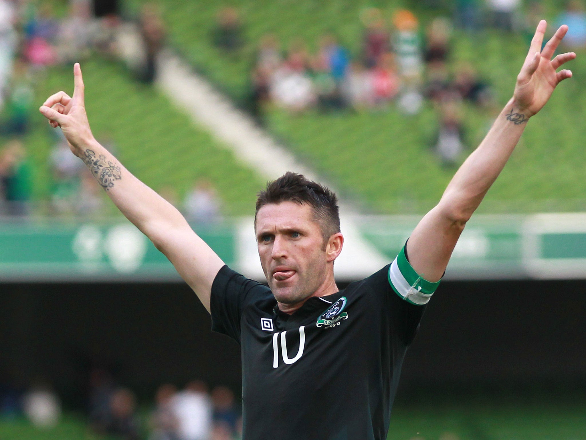 Robbie Keane celebrated equalling Shay Given's record caps haul with his 55th and 56th goals