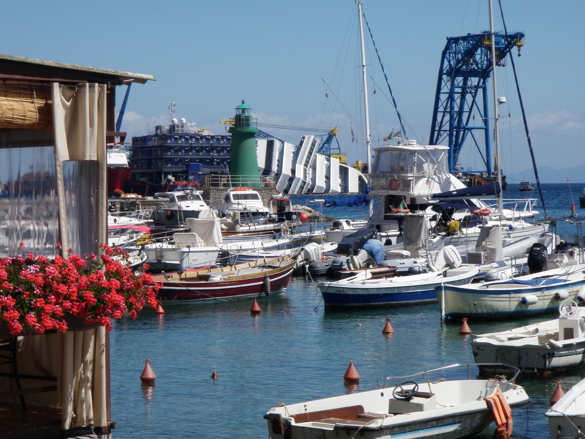 A view from Porto on the Tuscan island of Giglio shows how close the wreckage of the Costa Concordia is to the port (Photo: Martin King)