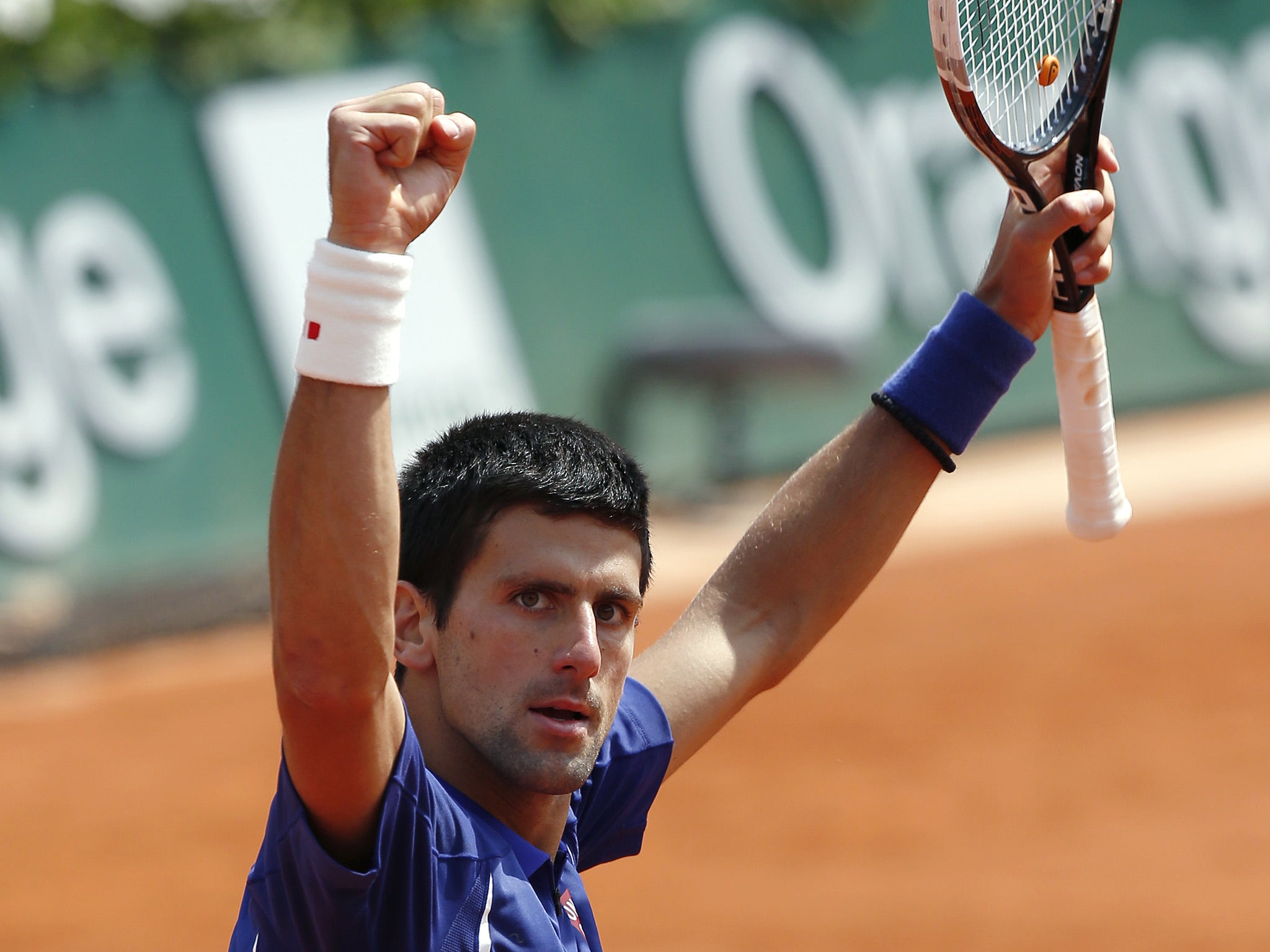 Serbia's Novak Djokovic celebrates his victory over Germany's Philipp Kohlschreiber at the end of their French Tennis Open round of sixteen match at the Roland Garros stadium in Paris
