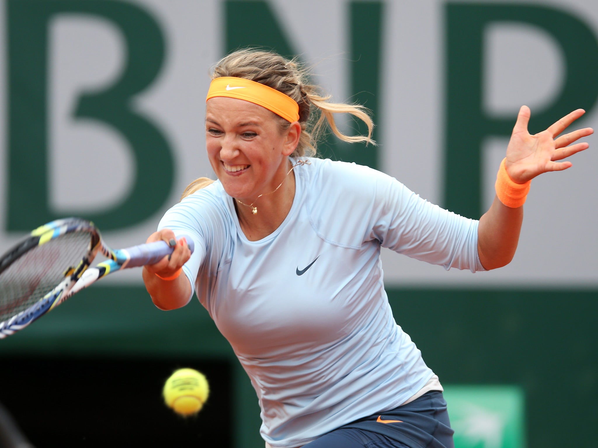 Victoria Azarenka of Belarus plays a forehand in her Women's Singles match against Francesca Schiavone of Italy during day nine of the French Open at Roland Garros