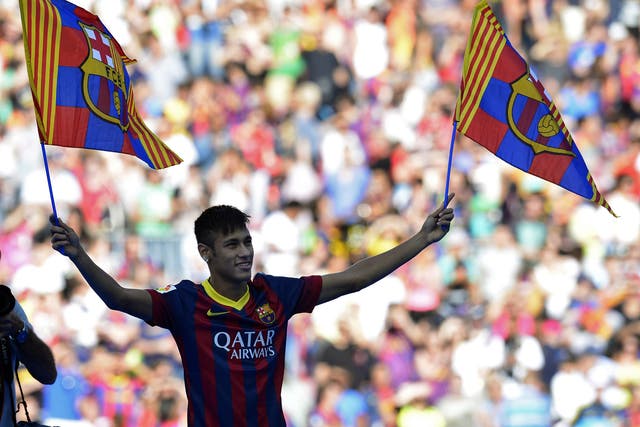 Neymar is presented to Barcelona fans after signing a five-year deal