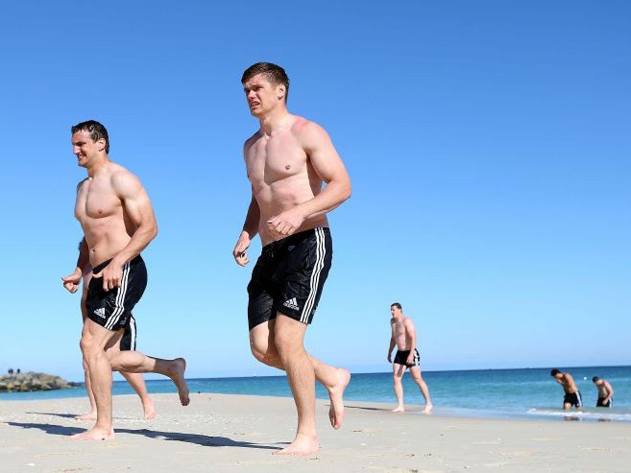 British and Irish Lions Owen Farrell and Sam Warburton (left) during a recovery session at City Beach, Perth in Australia (PA)