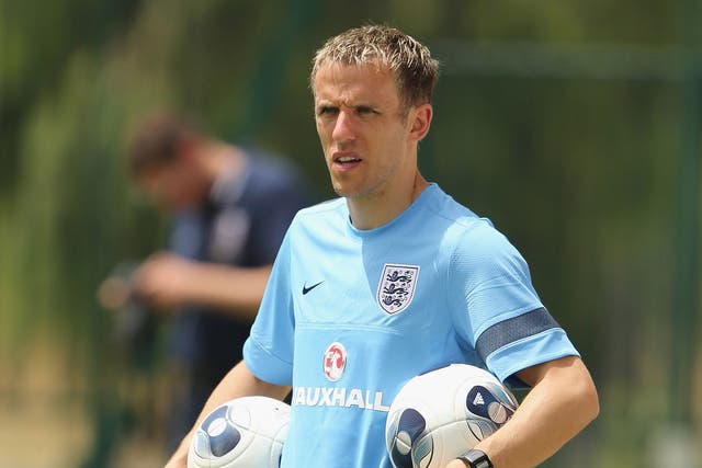 Phil Neville will return to his old club Manchester United as a coach this summer to join David Moyes' backroom staff
