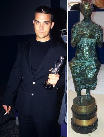 Robbie Williams with his Ivor Novello award in 1990; and the recovered statuette inset