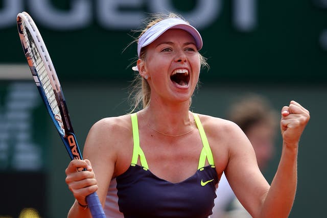 Maria Sharapova celebrates after reaching the semi-finals of the French Open