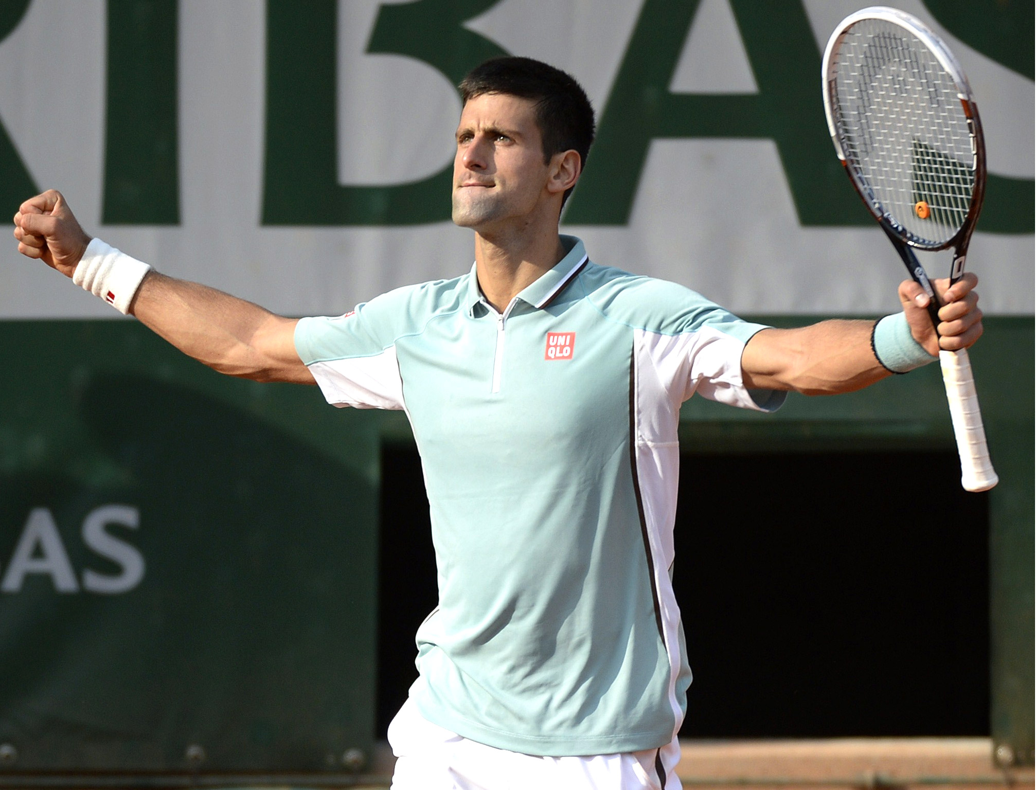 Novak Djokovic celebrates his quarter-final victory at the French Open