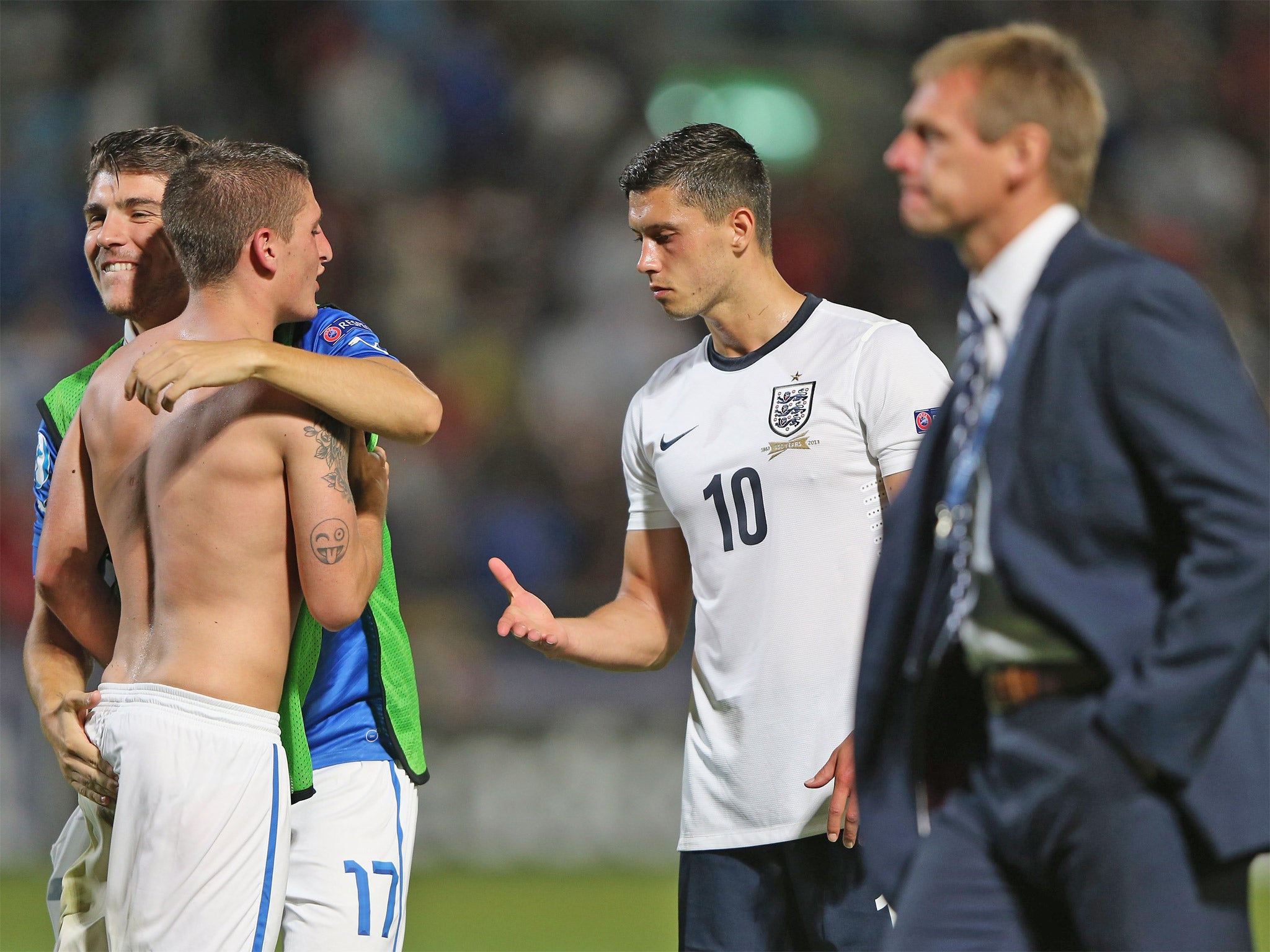 England captain Jason Lowe offers his hand to Italy's Alberto Paloschi after the game
