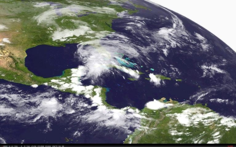 A satellite image made and released by the National Oceanic and Atmospheric Administration (NOAA) on 5 June 2013 of Tropical Storm Andrea in the Gulf of Mexico just West of central Florida