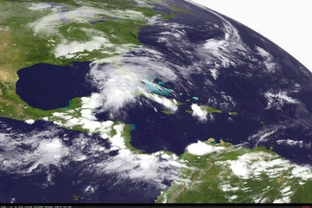 A satellite image made and released by the National Oceanic and Atmospheric Administration (NOAA) on 5 June 2013 of Tropical Storm Andrea in the Gulf of Mexico just West of central Florida