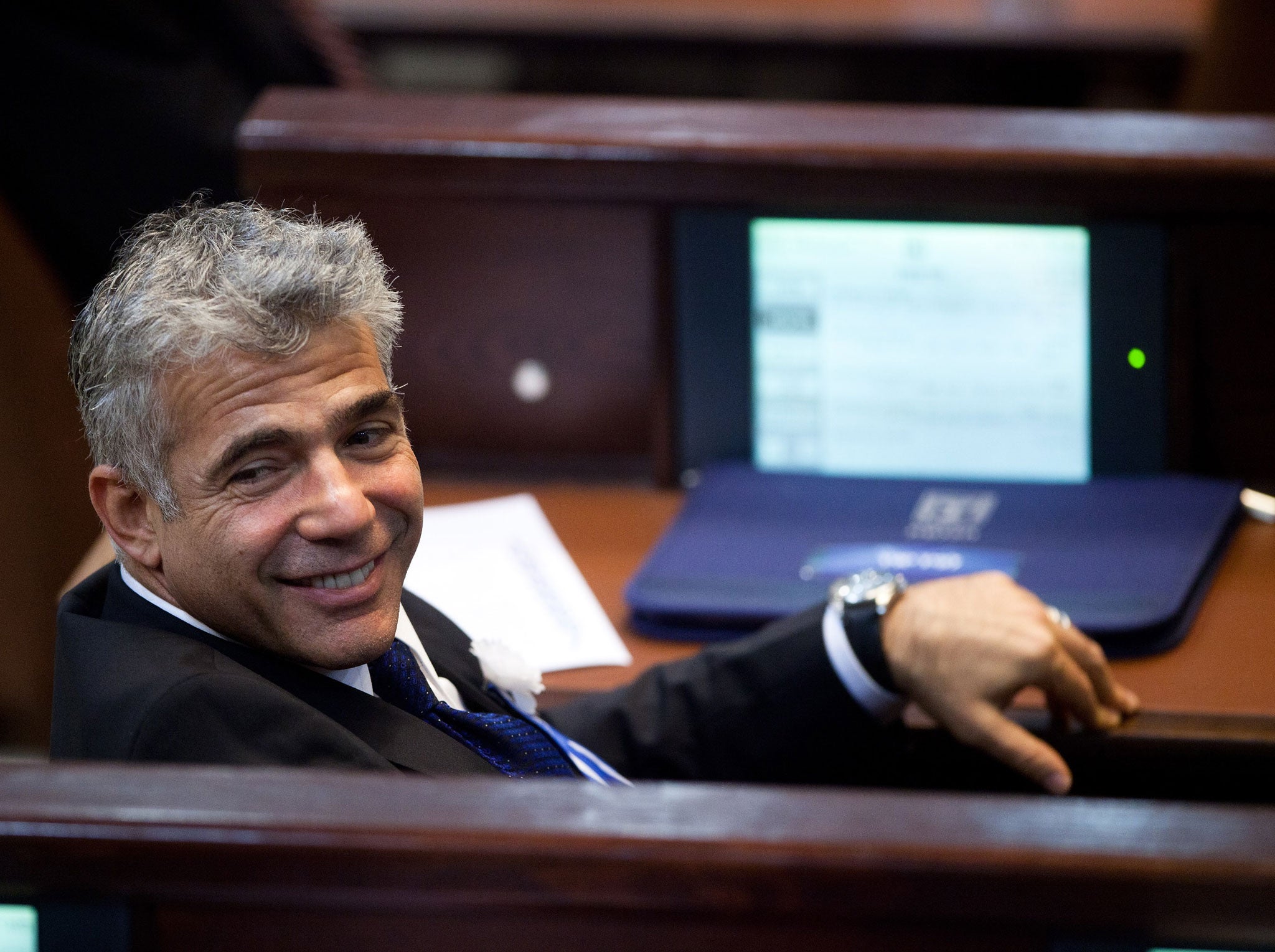 Yair Lapid leader of the Israeli Yesh Atid party attends the swearing-in ceremony of the 19th Knesset, the new Israeli parliament, on February 5, 2013 in Jerusalem, Israel.