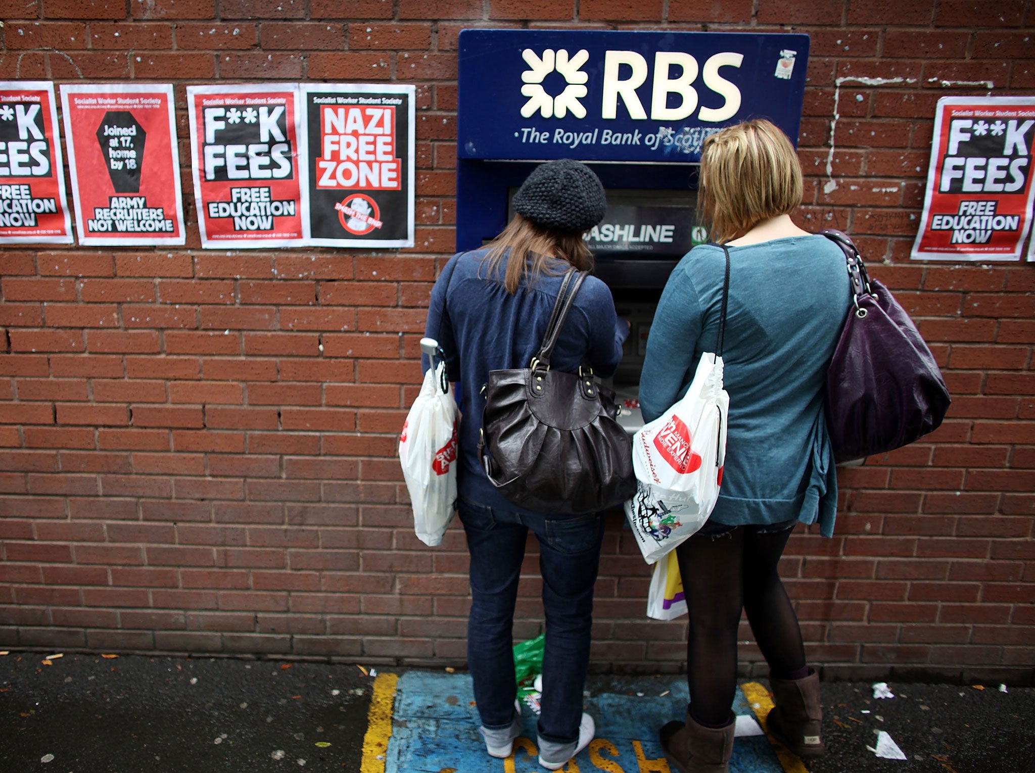 Students arriving for Manchester University's freshers week queue up at a cash machine to draw money on September 22, 2009 in Manchester, England.