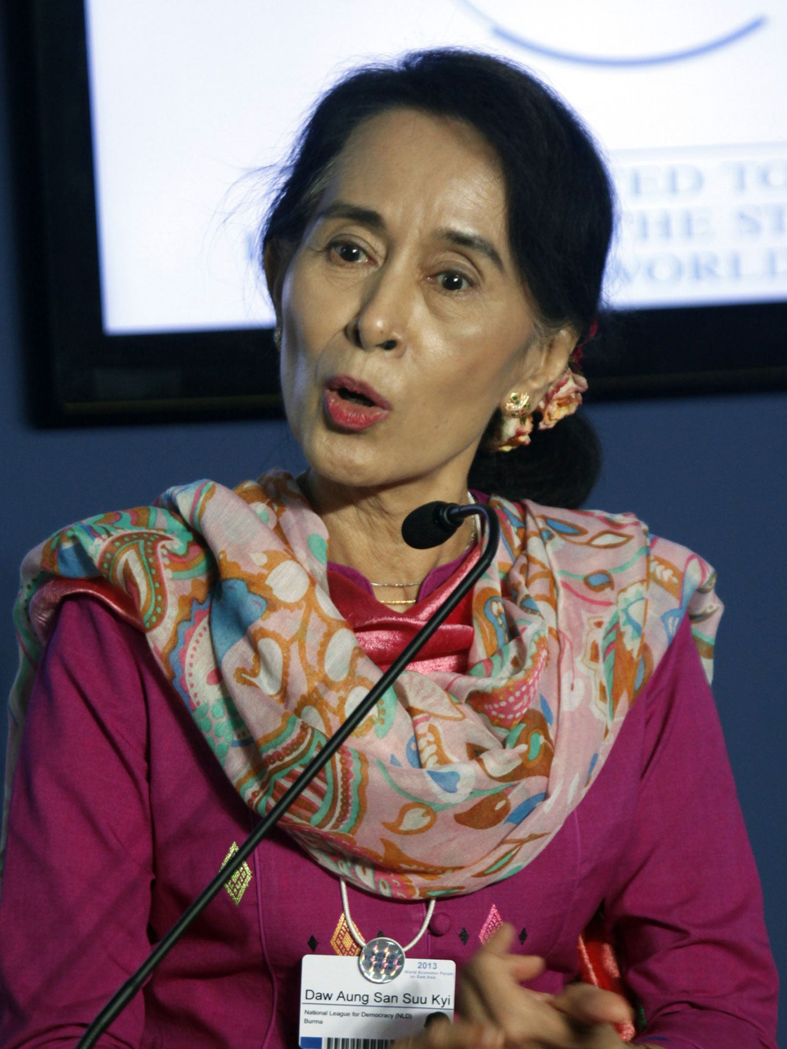 Myanmar's pro-democracy leader Aung San Suu Kyi talks to reporters during a news conference at the World Economic Forum