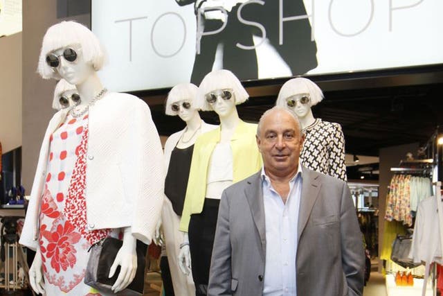 Sir Philip Green, a British billionaire and the CEO of the Arcadia Group, poses for a photograph at his new Topshop store in central Hong Kong (AP)
