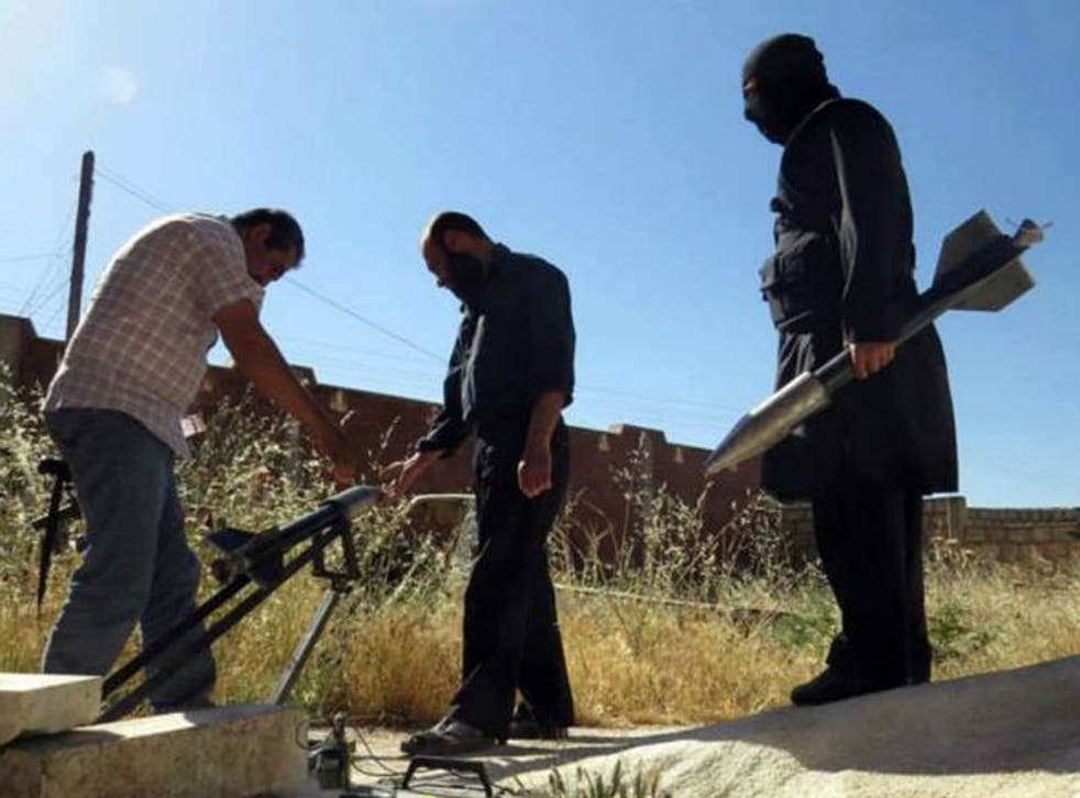 Syrian rebels preparing to fire locally made rockets