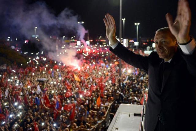 Turkish Prime Minister Recep Tayyip Erdogan greets his supporters following his arrival after a four day trip to North African countries at Ataturk Airport in Istanbul, Turkey