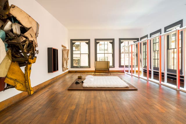 Intimate space: The 'make-out bed' at the centre of Donald Judd's studio, surrounded by his sculptures, a crushed-car piece and, on the back wall, a wooden box made by his father