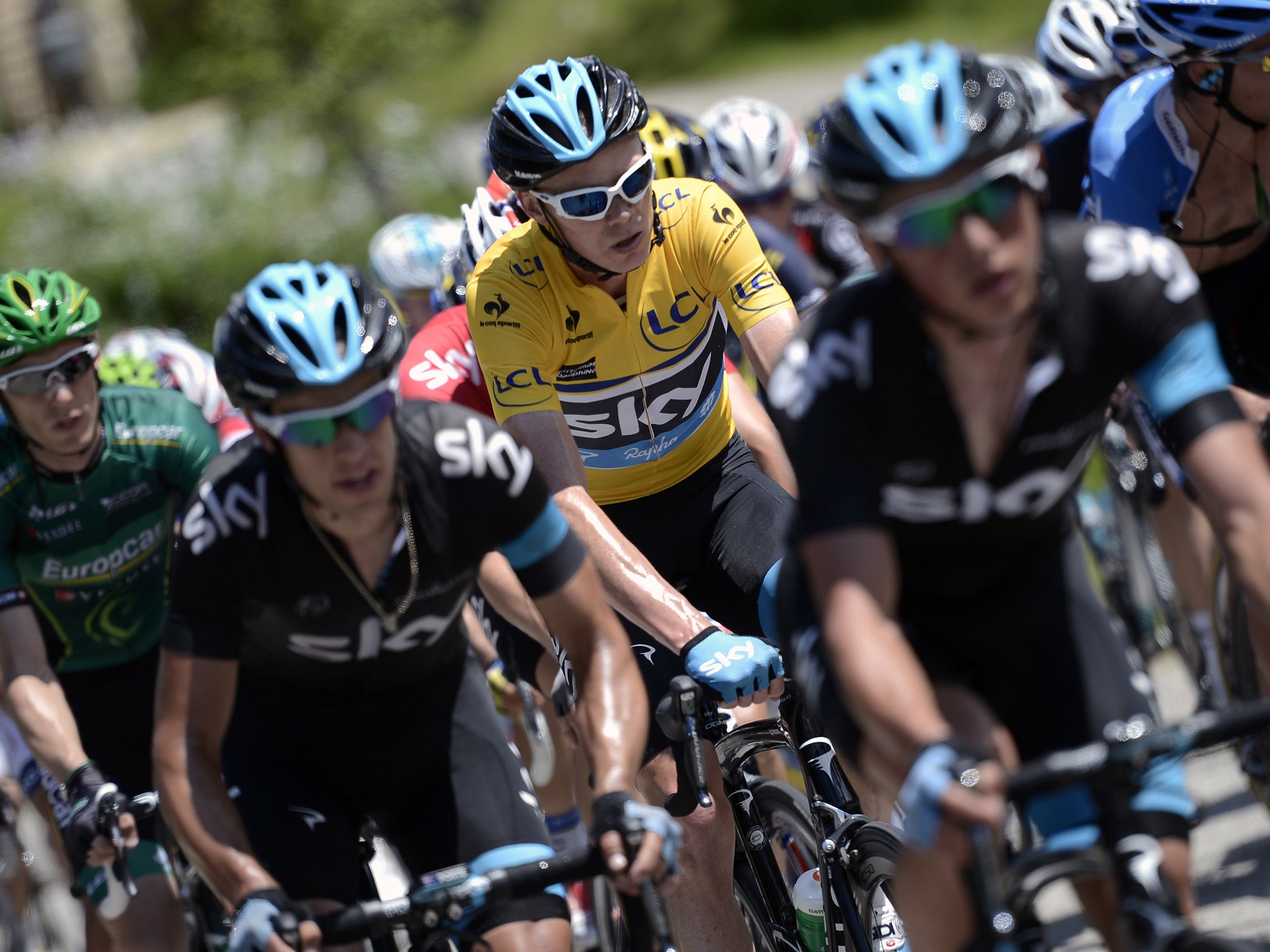 Overall leader Britain's Christopher Froome rides during the 143 km sixth stage of the 65th edition of the Dauphine Criterium